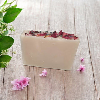 Think Pink Organic Soap unwrapped with dried flowers on top